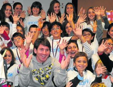 Messi and the kids.jpg