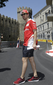Ferrari driver Sebastian Vettel of Germany, looks on as he walks along the Baku circuit, in Baku, Azerbaijan, Thursday, June 16, 2016. The Formula One Grand Prix of Europe will be held on Sunday. (AP Photo/Luca Bruno)