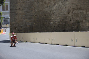 Ferrari driver Sebastian Vettel of Germany, looks on as he walks along the Baku circuit, in Baku, Azerbaijan, Thursday, June 16, 2016. The Formula One Grand Prix of Europe will be held on Sunday. (AP Photo/Luca Bruno)