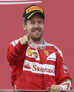 Second place, Ferrari driver Sebastian Vettel of Germany, celebrates his second place on the podium after the Formula One Grand Prix of Europe at the Baku circuit, in Baku, Azerbaijan, Sunday, June 19, 2016. (AP Photo/Luca Bruno)