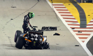 Force India driver Nico Hulkenberg of Germany walks from his car after crashing at the start of the Singapore Formula One Grand Prix on the Marina Bay City Circuit in Singapore, Sunday, Sept. 18, 2016. (AP Photo/Yong Teck Lim)