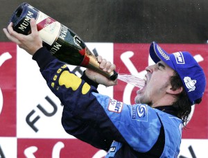 Reigning world champion Renault driver Fernando Alonso of Spain pours champagne into his mouth during the awarding ceremony after winning the Formula One Japanese Grand Prix at the Suzuka Circuit in Suzuka, central Japan, Sunday, Oct. 8, 2006. (AP Photo/Andy Wong) COPYRIGHT SCANPIX Code: 436