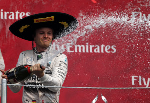 Mercedes driver Nico Rosberg of Germany celebrates at the podium after winning the Formula One Mexico Grand Prix auto race at the Hermanos Rodriguez racetrack in Mexico City, Sunday, Nov. 1, 2015.(AP Photo/Eduardo Verdugo)