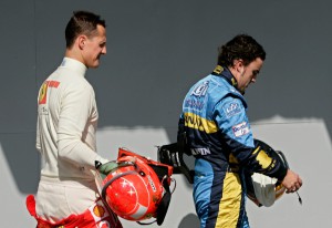 Spain's Fernando Alonso, right, of Renault walks followed by Germany's Michael Schumacher, left, of the Ferrari team after qualifying for the Brazilian Grand Prix at the Interlagos racetrack in Sao Paulo, Brazil, on Saturday, Oct. 21, 2006. Brazil's Grand Prix will take place on Sunday, Oct. 22. (AP Photos/Victor R. Caivano) COPYRIGHT SCANPIX Code: 436