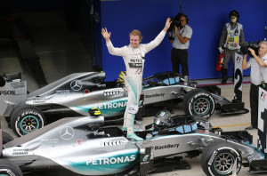 Mercedes driver Nico Rosberg of Germany, celebrates after finishing first in the Formula One Brazilian Grand Prix at the Interlagos race track in Sao Paulo, Brazil, Sunday, Nov. 15, 2015. (AP Photo/Silvia Izquierdo)