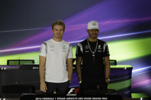 Mercedes driver Lewis Hamilton of Britain, right, and his teammate Nico Rosberg of Germany pose for a picture prior to a news conference at the Yas Marina racetrack in Abu Dhabi, United Arab Emirates, Thursday, Nov. 24, 2016. The Emirates Formula One Grand Prix will take place on Sunday. (AP Photo/Hassan Ammar)