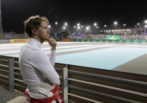 Ferrari driver Sebastian Vettel, of Germany, stands after his car broke down during the second practice session at the Yas Marina racetrack in Abu Dhabi, United Arab Emirates, Friday, Nov. 25, 2016. The Emirates Formula One Grand Prix will take place on Sunday. (AP Photo/Hassan Ammar)