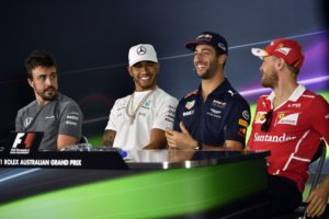 Formula One drivers (from left) McLaren's Spanish driver Fernando Alonso, Mercedes' British driver Lewis Hamilton, Red Bull's Australian driver Daniel Ricciardo and Ferrari's German driver Sebastian Vettel share a joke during a press conference in Melbourne on March 23, 2017, ahead of the Formula One Australian Grand Prix. / AFP PHOTO / SAEED KHAN / -- IMAGE RESTRICTED TO EDITORIAL USE - STRICTLY NO COMMERCIAL USE --