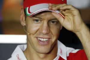 Ferrari driver Sebastian Vettel of Germany smiles as he attends a press conference for Sunday's Formula One Italian Grand Prix, at the Monza racetrack, Italy, Thursday, Sept. 1, 2016. (AP Photo/Antonio Calanni)