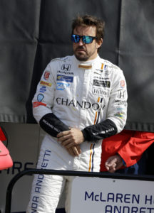 Race driver Fernando Alonso of Spain prepares to drive for the first time at the Indianapolis Motor Speedway in Indianapolis, Wednesday, May 3, 2017. Alonso plans to miss the Monaco Grand Prix this year to drive in the Indianapolis 500. (AP Photo/Michael Conroy)