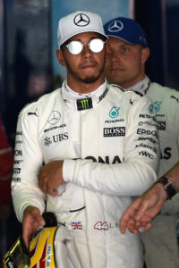 (L to R) Mercedes' British driver Lewis Hamilton and Mercedes' Finish driver Valtteri Bottas walk in the parc ferme after the qualifying session at the Circuit de Catalunya on May 13, 2013 in Montmelo on the outskirts of Barcelona ahead of the Spanish Formula One Grand Prix. / AFP PHOTO / TOM GANDOLFINI