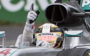 Mercedes driver Lewis Hamilton, of Britain, signals after winning the Canadian Grand Prix auto race in Montreal, Sunday, June 12, 2016. (Graham HUghes/The Canadian Press via AP) MANDATORY CREDIT