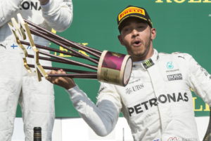 Mercedes driver Lewis Hamilton, of Britain, celebrates his victory at the Canadian Grand Prix auto race Sunday, June 11, 2017, in Montreal. (Pail Chiasson/The Canadian Press via AP)