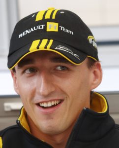 Renault Formula One driver Robert Kubica of Poland talks to the media outside his team garage at the British Formula One Grand Prix  in Silverstone, England, Thursday, July 8, 2010. (AP Photo/Max Nash)