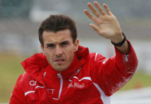 Marussia driver Jules Bianchi of France waves during drivers' parade before the Japanese Formula One Grand Prix at the Suzuka Circuit in Suzuka, central Japan, Sunday, Oct. 5, 2014. Bianchi has been taken to hospital and is unconscious following a crash during the Japanese Grand Prix. The race was red-flagged with nine laps to go after Bianchi went off at Turn 7, where Sauber's Adrian Sutil had crashed earlier. (AP Photo/Shizuo Kambayashi) / TT / kod 436