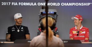 Scuderia Ferrari's German driver Sebastian Vettel (R) and Mercedes AMG Petronas F1 Team's British driver Lewis Hamilton attend a press conference ahead of the Austrian Formula One Grand Prix on July 06, 2017. / AFP PHOTO / JOE KLAMAR