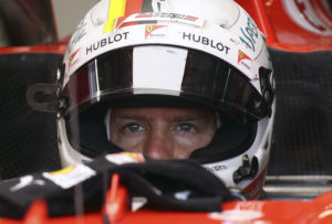Ferrari driver Sebastian Vettel of Germany sits in his car cockpit during the second practice session for the Austrian Formula One Grand Prix at the Red Bull Ring in Spielberg, Austria, Friday, July 7, 2017. The Austrian Grand Prix will be held on Sunday. (AP Photo/Ronald Zak)