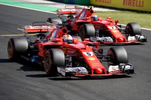 Ferrari's German driver Sebastian Vettel (L) and Ferrari's Finnish driver Kimi Raikkonen take part in the qualifying at the Hungaroring racing circuit in Budapest on July 29, 2017 prior to the Formula One Hungarian Grand Prix. / AFP PHOTO / ANDREJ ISAKOVIC