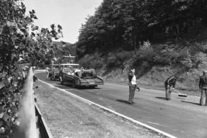 Two rescue cars carrying away damaged race cars of Niki Lauda and Brett Lunger (on first car, at left) and the Hesketh car of German Harald Ertl after spectacular crash during West German Grand Prix at the Nuerburgring circuit on August 1, 1976. Austrian World Champion was injured and taken into hospital. (AP Photo/Hill)