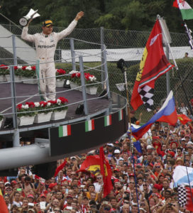 Mercedes driver Nico Rosberg of Germany, celebrates on the podium after winning the Italian Formula One Grand Prix at the Monza racetrack, Italy, Sunday, Sept. 4, 2016. (AP Photo/STR)
