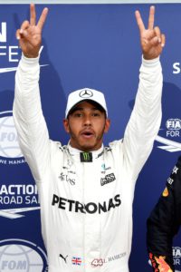Mercedes' British driver Lewis Hamilton celebrates winning the pole position after the qualifying session at the Autodromo Nazionale circuit in Monza on September 2, 2017 ahead of the Italian Formula One Grand Prix. / AFP PHOTO / ANDREJ ISAKOVIC