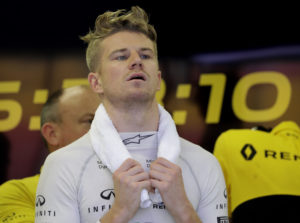 Renault driver Nico Hulkenberg of Germany waits in his team garage during the first practice session at the Singapore Formula One Grand Prix on the Marina Bay City Circuit Singapore, Friday, Sept. 15, 2017. (AP Photo/Wong Maye-E)