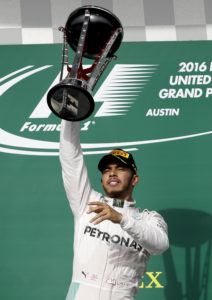 Mercedes driver Lewis Hamilton, of Britain, celebrates his win in the Formula One U.S. Grand Prix auto race at the Circuit of the Americas, Sunday, Oct. 23, 2016, in Austin, Texas. (AP Photo/Eric Gay)