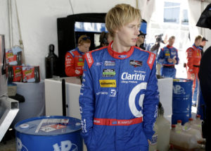 FILE - In this Jan. 29, 2016, file photo, Brendon Hartley, of New Zealand watches in the garage during the final practice session before the IMSA 24-hour auto race at Daytona International Speedway in Daytona Beach, Fla. Chip Ganassi Racing will return to a two-car team in the IndyCar Series next season. Scott Dixon will return as driver of the No. 9, and the team said a driver for the No. 10 will be announced later. It is widely believed that New Zealand's Brendon Hartley will take over that seat. (AP Photo/John Raoux, File)