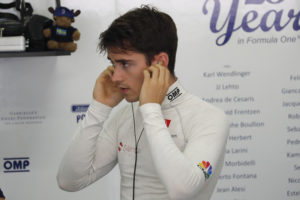 Sauber test driver Charles Leclerc of Monaco adjusts his earplug before the first practice session for the Malaysian Formula One Grand Prix at Sepang International Circuit in Sepang, Malaysia, Friday, Sept. 29, 2017. (AP Photo/Vincent Thian)