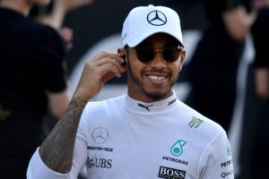 Mercedes' British driver Lewis Hamilton gestures ahead of the Abu Dhabi Formula One Grand Prix at the Yas Marina circuit on November 26, 2017. / AFP PHOTO / Andrej ISAKOVIC