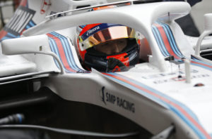 Williams reserve driver Robert Kubica of Poland sits in his car cockpit in the pit lane during a Formula One pre-season testing session at the Catalunya racetrack in Montmelo, outside Barcelona, Spain, Tuesday, Feb. 27, 2018. (AP Photo/Francisco Seco)