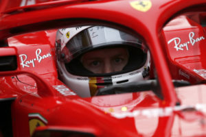 Ferrari driver Sebastian Vettel of Germany sits in his car cockpit in the pit lane during a Formula One pre-season testing session at the Catalunya racetrack in Montmelo, outside Barcelona, Spain, Tuesday, Feb. 27, 2018. (AP Photo/Francisco Seco)