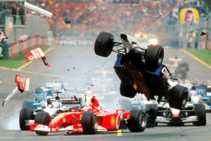 The Williams of Ralf Schumacher of Germany, right, flies over the Ferrari of Brazil's Rubens Barrichello as they collide while heading for the first corner of the first lap of the Australian Formula One Grand Prix in Melbourne, Sunday, March 3, 2002. Both drivers escaped injury but were not able to continue the race eventuly won by Ferrari's Michael Schumacher. (AP Photo/Australian Grand Prix Corp., Joe Mann)