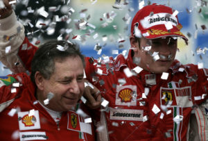 Ferrari team director Jean Todt, left, celebrates with Finland's Kimi Raikkonen after the Brazilian Formula One Grand Prix at the Interlagos race track in Sao Paulo, Sunday, Oct. 21, 2007. By winning one of the most dramatic finales in recent years to clinch his first Formula One title, Kimi Raikkonen capped a brilliant first season with Ferrari.(AP Photo/Victor R. Caivano)
