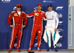 Formula 1 F1 - Bahrain Grand Prix - Bahrain International Circuit, Sakhir, Bahrain - April 7, 2018 Ferrari's Sebastian Vettel celebrates pole position with Ferrari's Kimi Raikkonen and Mercedes' Valtteri Bottas after qualifying REUTERS/Hamad I Mohammed