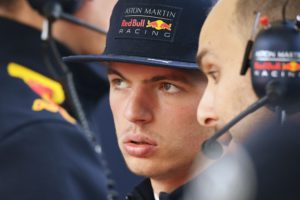 Red Bull's Dutch driver Max Verstappen chats with team members during a practice session for the Formula One Chinese Grand Prix in Shanghai on April 14, 2018. / AFP PHOTO / GREG BAKER