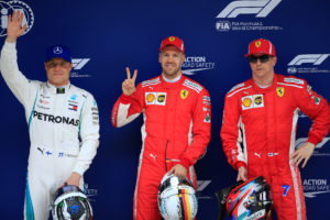 Formula One - F1 - Chinese Grand Prix - Shanghai, China - April 14, 2018 - Ferrari's Sebastian Vettel, Ferrari's Kimi Raikkonen and Mercedes' Valtteri Bottas celebrate after qualifying. REUTERS/Aly Song