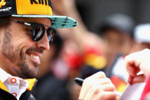 MONTREAL, QC - JUNE 07: Fernando Alonso of Spain and McLaren F1 signs autographs for fans during previews ahead of the Canadian Formula One Grand Prix at Circuit Gilles Villeneuve on June 7, 2018 in Montreal, Canada. Mark Thompson/Getty Images/AFP == FOR NEWSPAPERS, INTERNET, TELCOS & TELEVISION USE ONLY ==