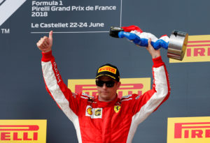 Formula One F1 - French Grand Prix - Circuit Paul Ricard, Le Castellet, France - June 24, 2018 Ferrari's Kimi Raikkonen celebrates with the third placed trophy on the podium after the race REUTERS/Jean-Paul Pelissier