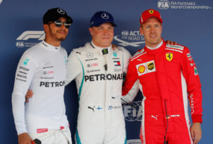 Formula One F1 - Russian Grand Prix - Sochi, Russia - September 29, 2018 Mercedes' Valtteri Bottas (C) after qualifying in pole position with teammate Lewis Hamilton (L), who qualified second and Ferrari's Sebastian Vettel, who qualified third REUTERS/Maxim Shemetov