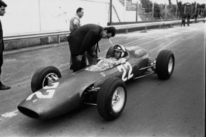 British driver John Surtees at the wheel of the new eight cylinder Italian Ferrari car, with which he will compete in the April 12, 1964 Syracuse Grand Prix Formula One Auto Race. (AP Photo/Girolamo di Majo)