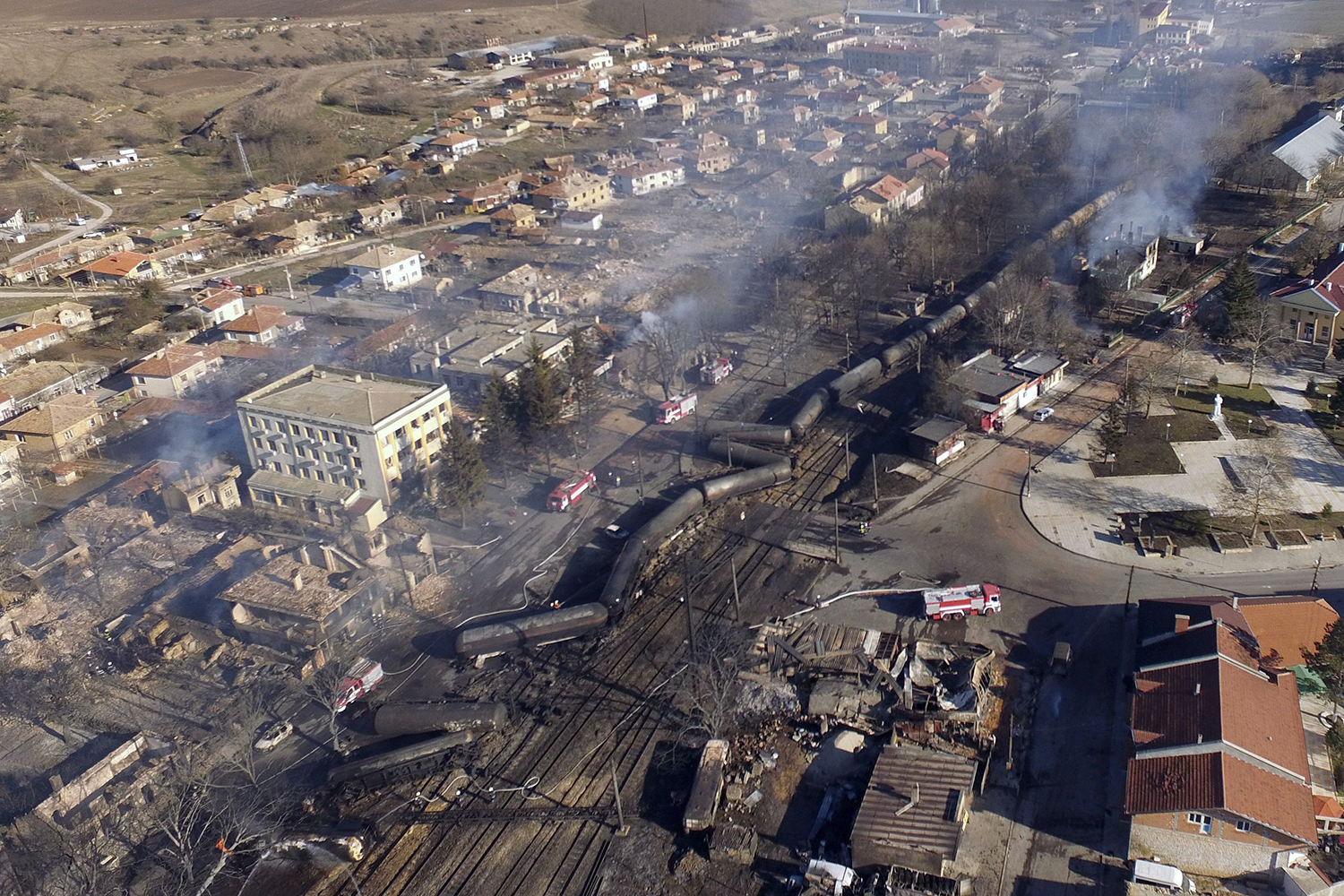 TOPSHOT - An aerial view shows the wreckage of a train transporting gas after it derailed and exploded in the northeastern Bulgarian village of Hitrino on December 10, 2016. At least five people died and 27 were injured in the blast, emergency services said. Around 20 homes were smashed and many of the residents of the village of some 800 people were evacuated. / AFP PHOTO / Boris KOLEV / TT / kod 444