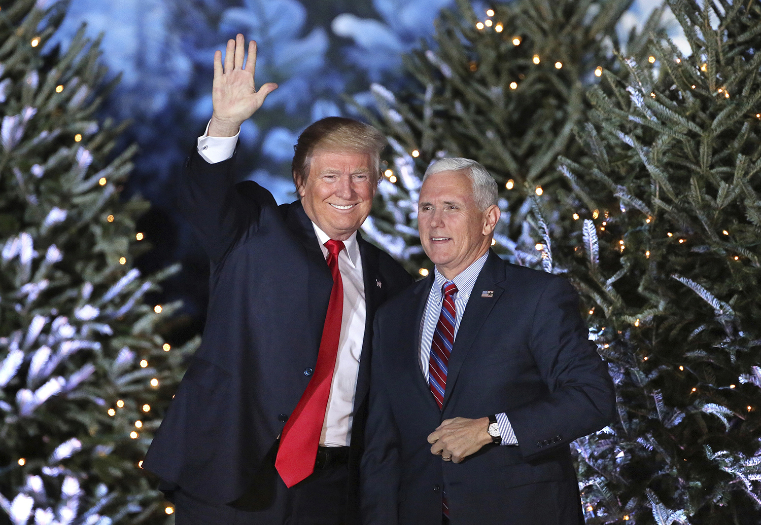 President-elect Donald Trump takes the stage with Vice President-elect Mike Pence during a rally in Orlando, Fla., Friday night, Dec. 16, 2016. (Joe Burbank/Orlando Sentinel via AP)