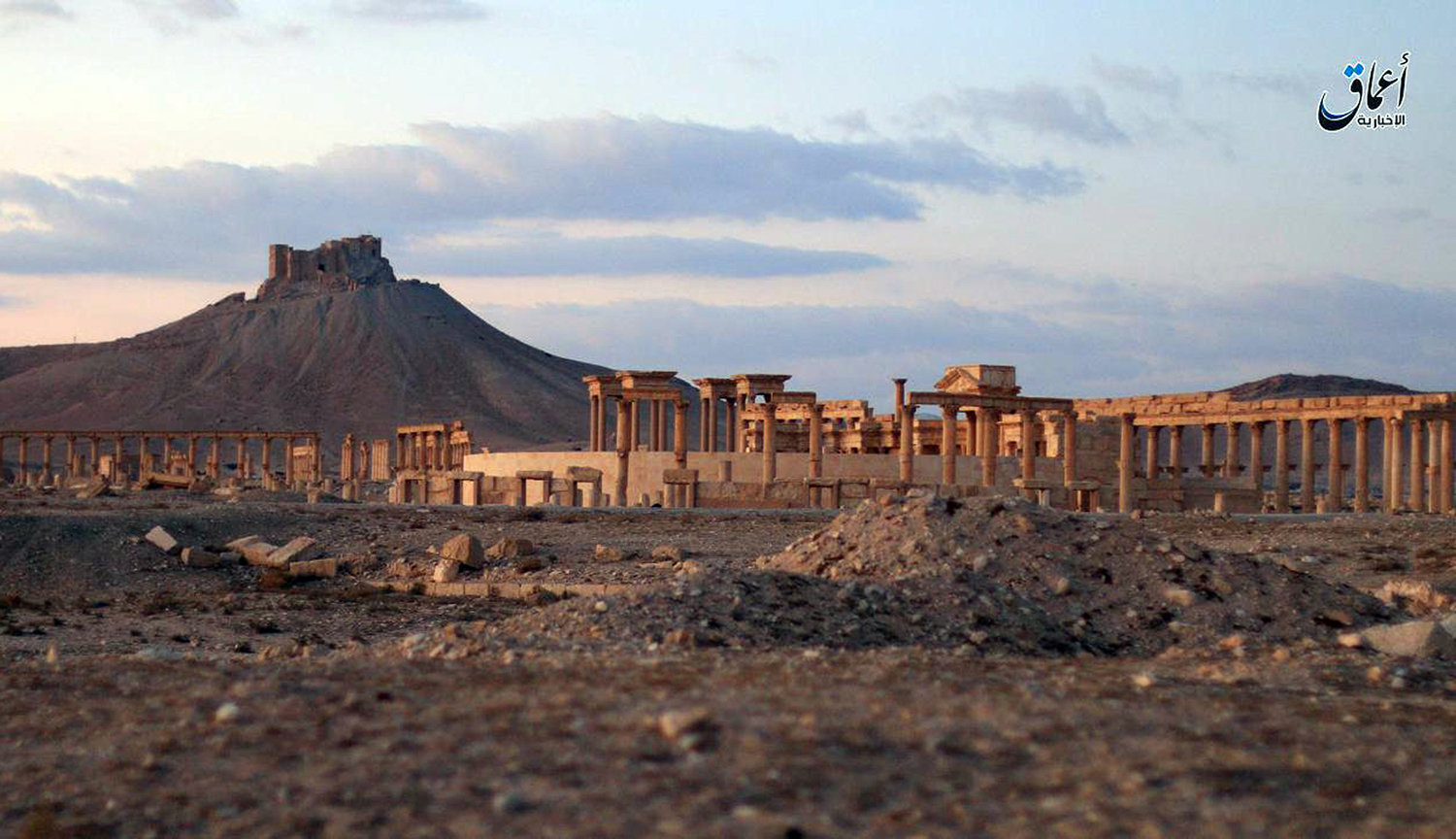 This image posted online on Sunday, Dec. 11, 2016, by the Aamaq News Agency, a media arm of the Islamic State group, purports to show a general view of the ancient ruins of the city of Palmyra, in Homs province, Syria, with the Citadel of Palmyra in the background. (Militant video via AP)