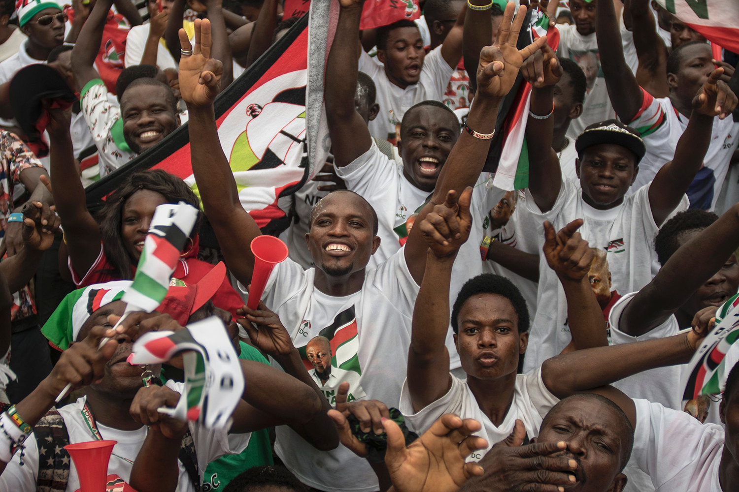 TOPSHOT - Supporters of the NDC (National Democratic Congress) party attend in the Accra Sports Stadium on December 5, 2016, the last NDC rally before the December 7 presidential elections. Fears about the erosion of Ghana's democracy have dominated the presidential campaign, with claims of voter intimidation and questions over independence of the Electoral Commission. / AFP PHOTO / CRISTINA ALDEHUELA / TT / kod 444