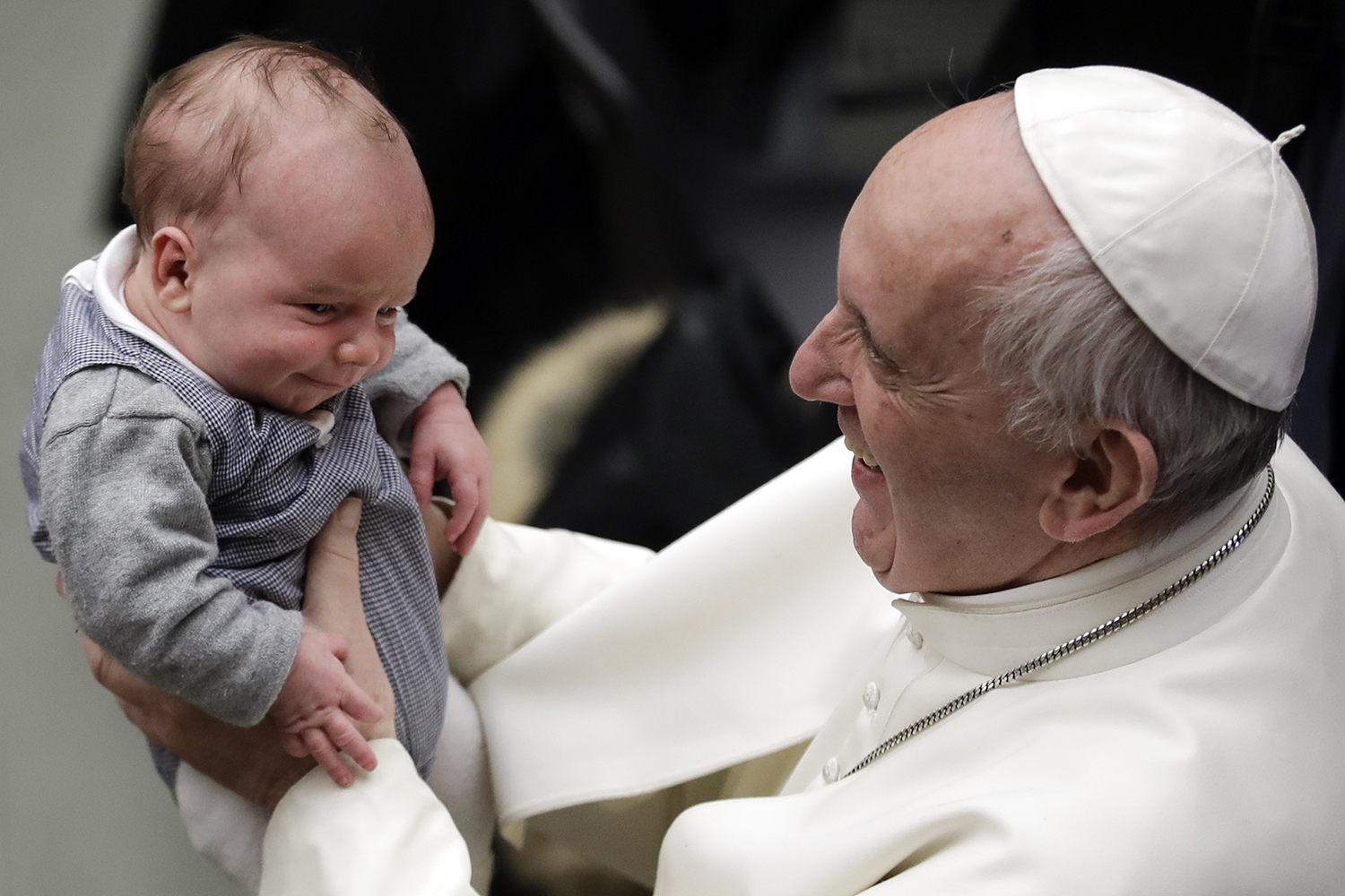 Pope Francis holds a baby during an audience with members of Entrepreneurs for Economy of Communion, at the Paul VI Hall, at the Vatican, Saturday, Feb. 4, 2017. (AP Photo/Andrew Medichini)