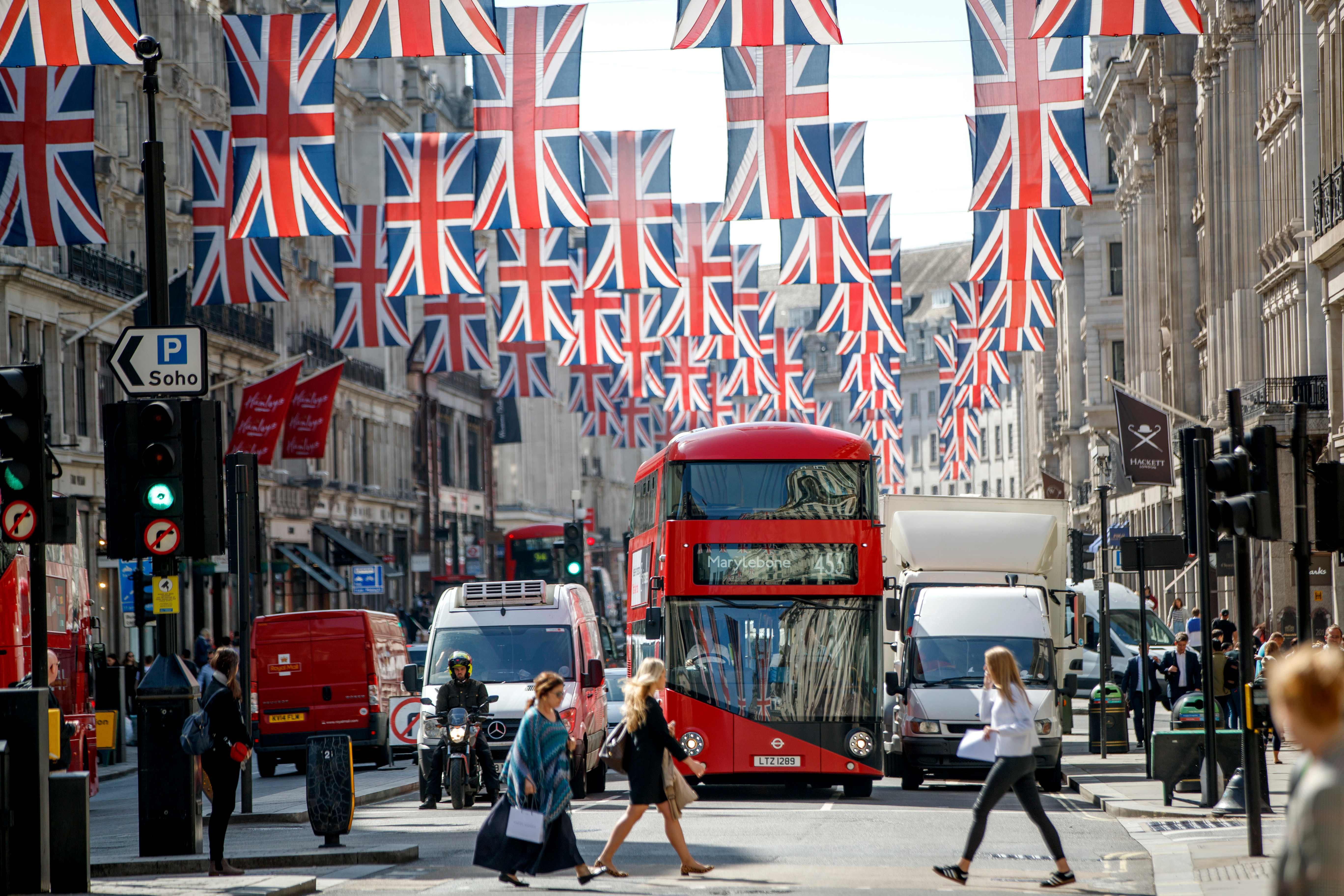 Union flag decorations are seen in Regent Street, London on May 11, 2018 ahead of the Royal Wedding of Prince Harry and US actress Meghan Markle. Britain's Prince Harry and US actress Meghan Markle will marry on May 19 at St George's Chapel in Windsor Castle. / AFP PHOTO / Tolga AKMEN