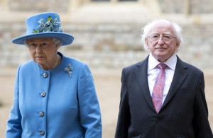 Britain's Queen Elizabeth walks with the President of Ireland Michael D. Higgins during a ceremonial welcome at Windsor Castle in Windsor